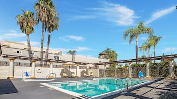 Outdoor pool, open 9:00 AM to 11:00 PM, pool umbrellas, sun loungers