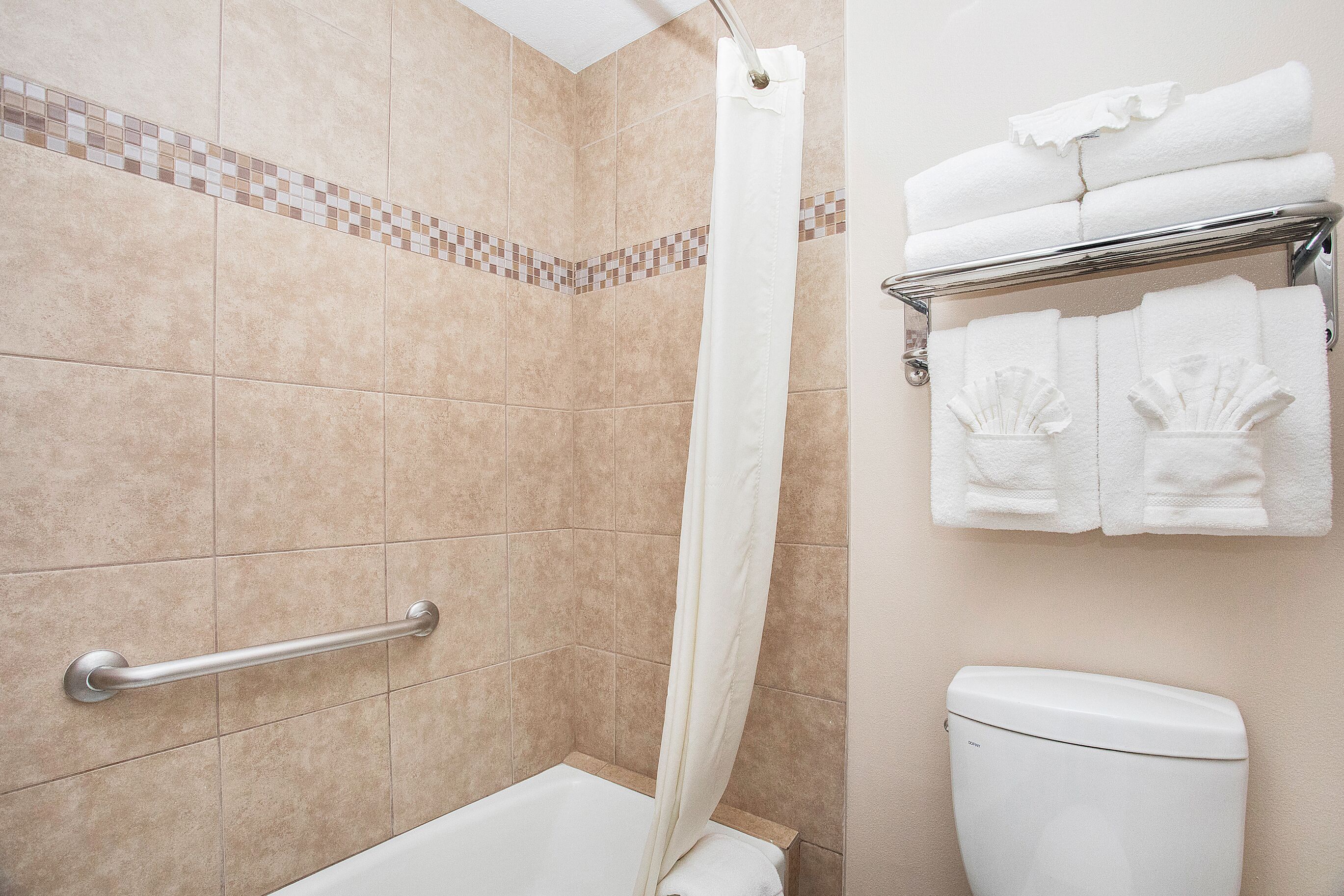 combined shower/bathtub, hair dryer, towels, soap