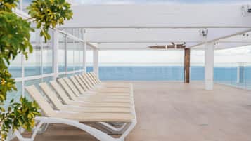 Indoor pool, outdoor pool, pool umbrellas, pool loungers