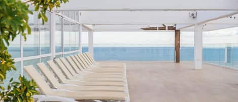 Indoor pool, outdoor pool, pool umbrellas, pool loungers