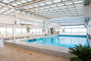 Indoor pool, outdoor pool, pool umbrellas, sun loungers