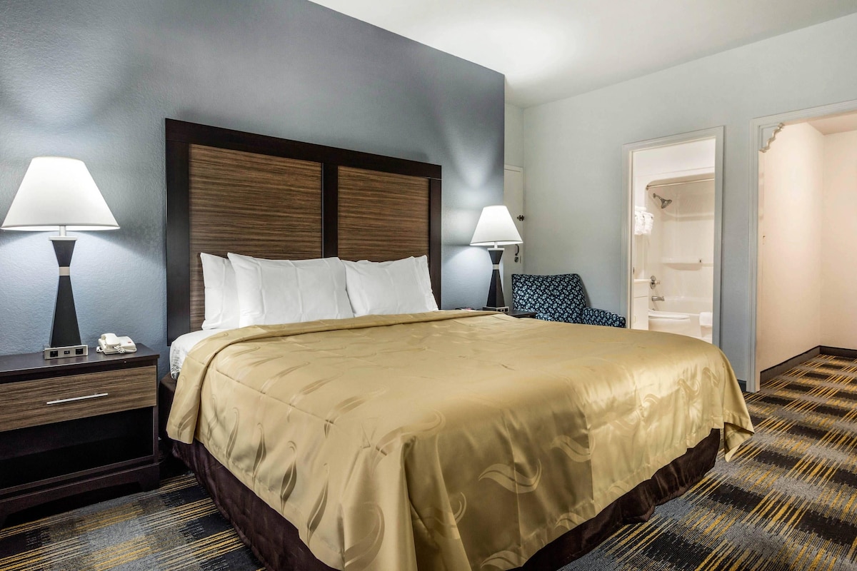 Premium bedding, desk, laptop workspace, iron/ironing board