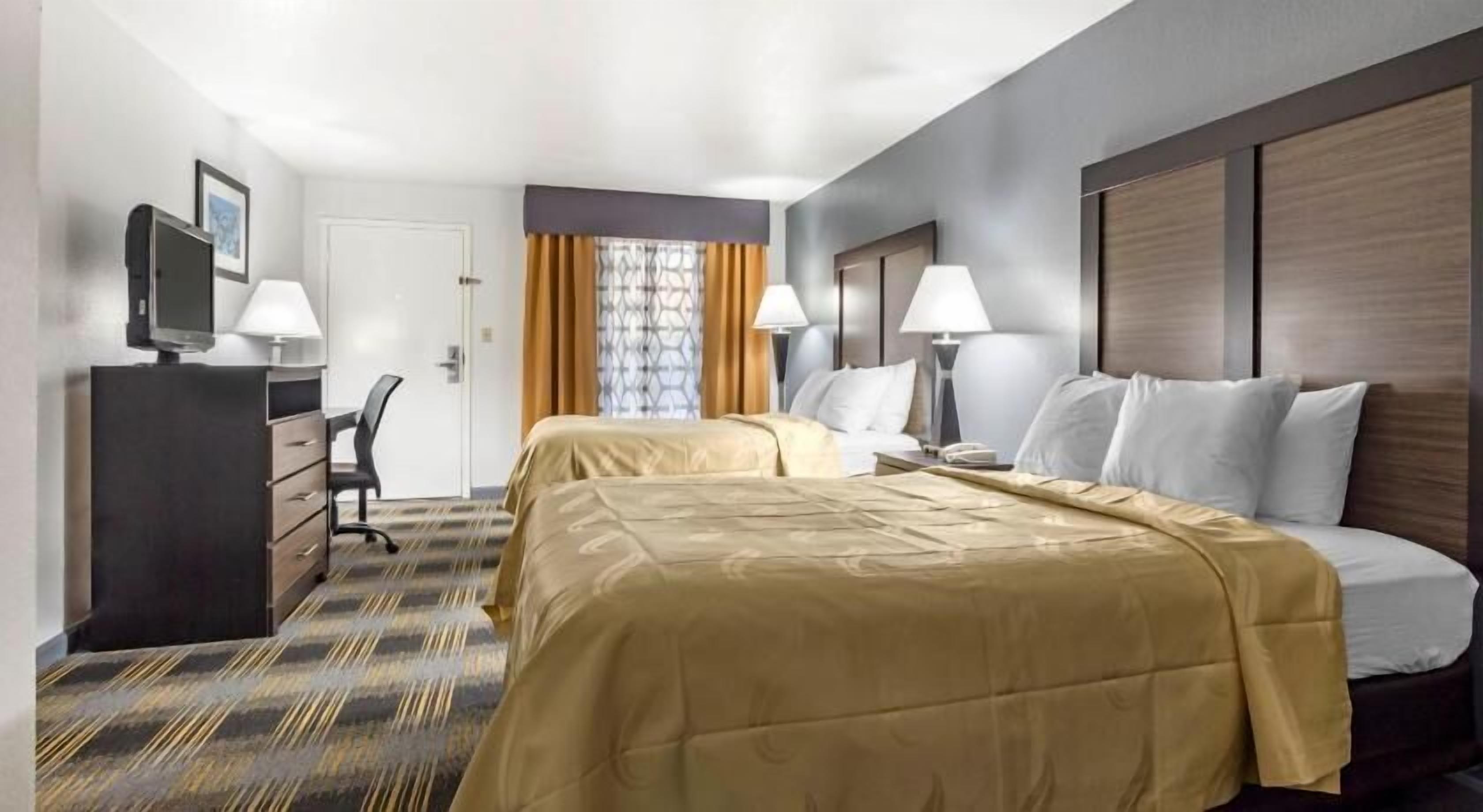 Premium bedding, desk, laptop workspace, iron/ironing board