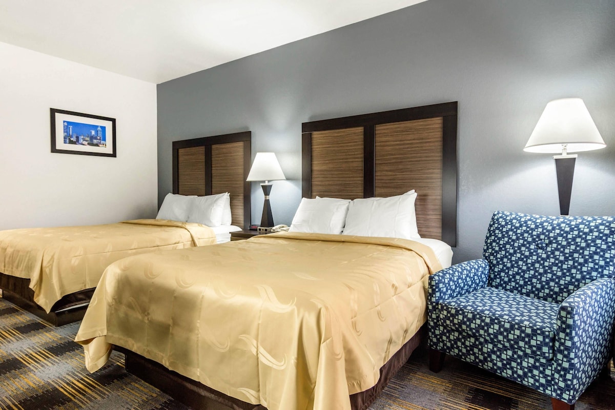 Premium bedding, desk, laptop workspace, iron/ironing board