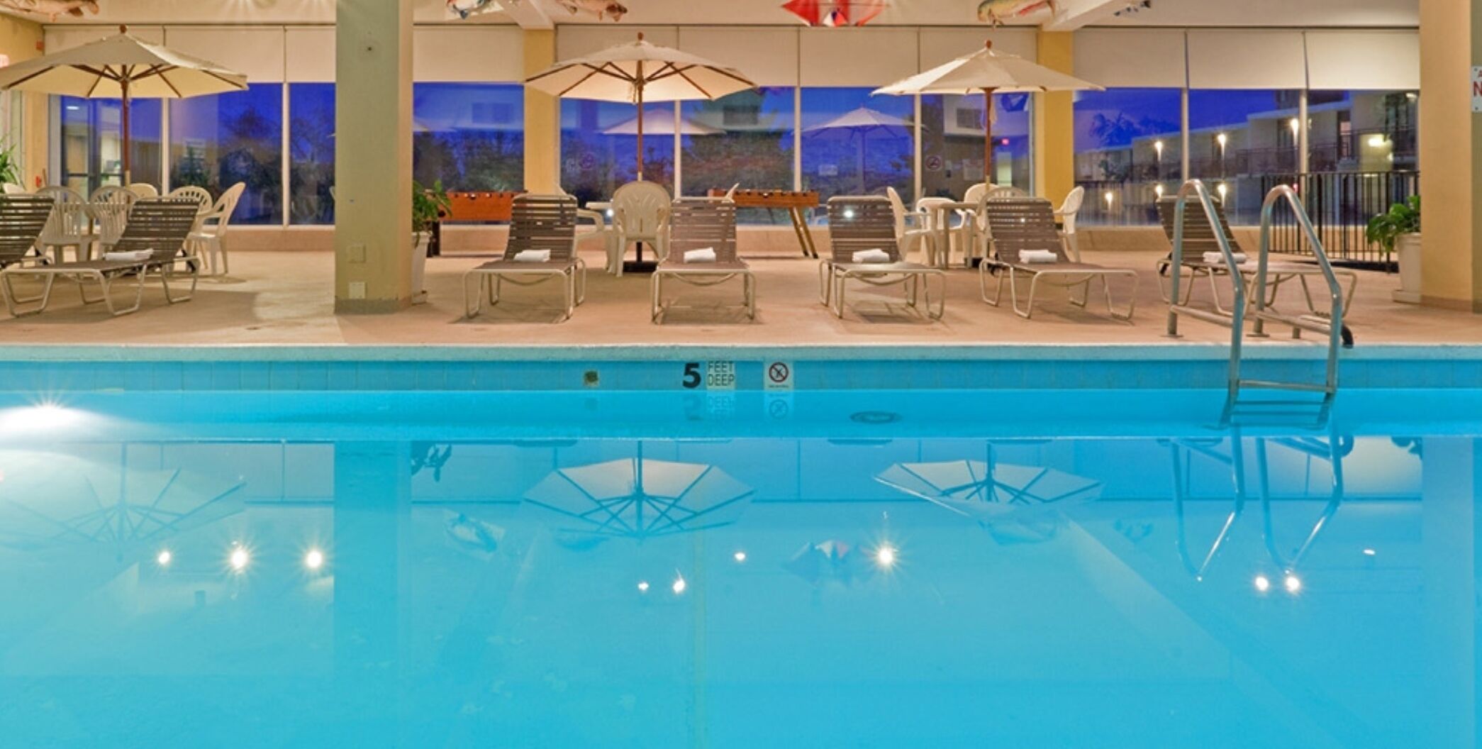 indoor pool, seasonal outdoor pool, pool umbrellas, pool loungers