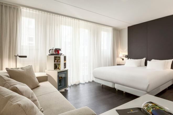Premium bedding, down comforters, minibar, in-room safe