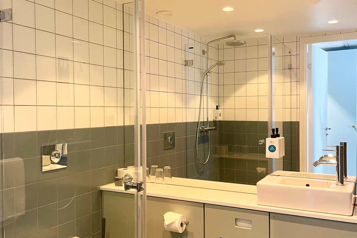 superior double room | bathroom | eco-friendly toiletries, hair dryer, heated floors, towels