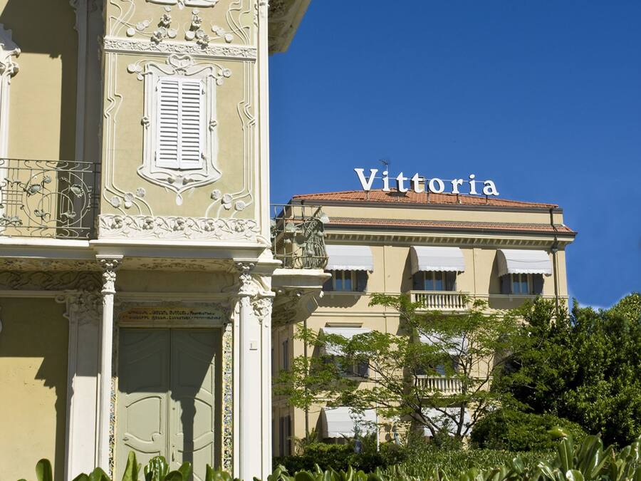 A building with ornate architectural details and the name "Vittoria" on the facade.