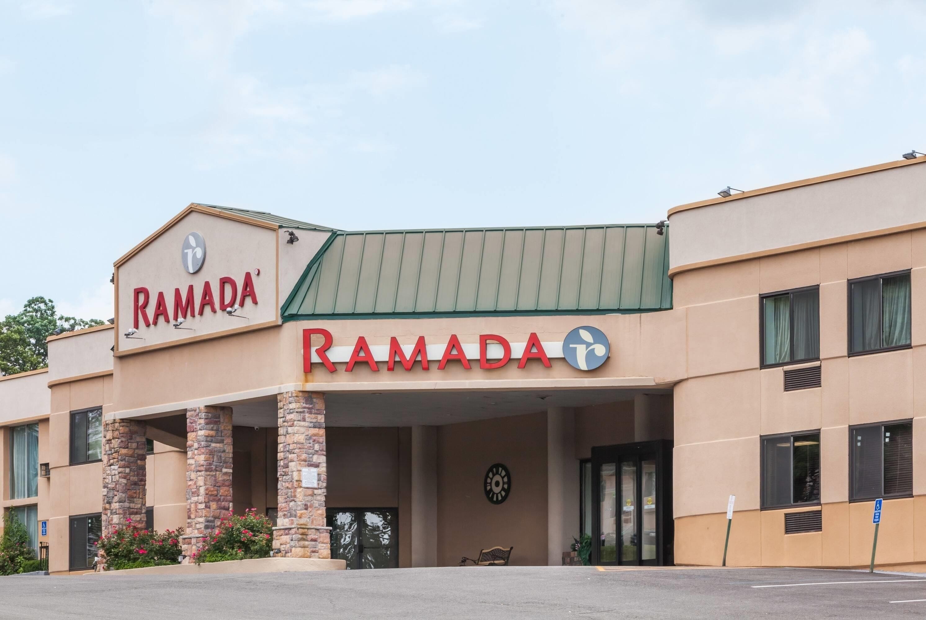 A building with a sign that reads "RAMADA".