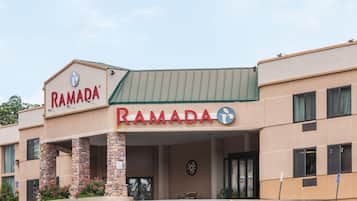 A building with a sign that reads "RAMADA".