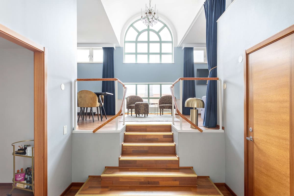 suite, multiple beds, non smoking (living room) | in-room safe, desk, laptop workspace, iron/ironing board