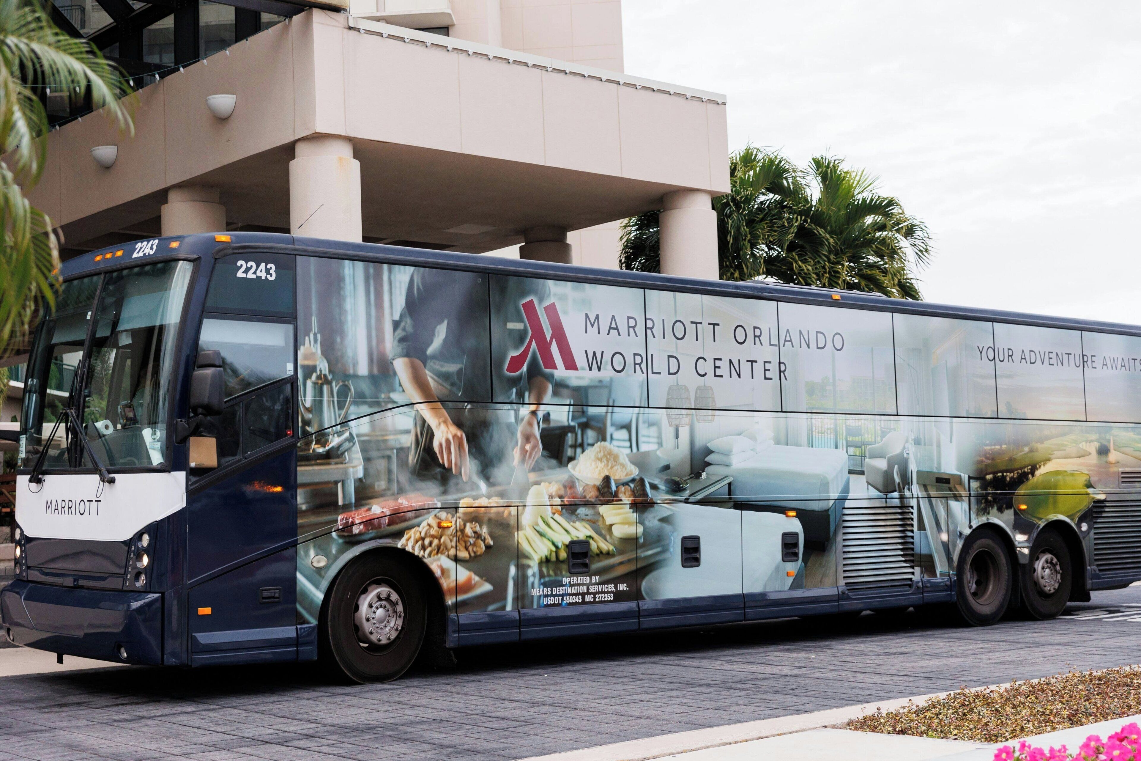 A large bus with the Marriott Orlando World Center logo and images of food and cooking.