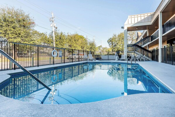 Outdoor pool, open 9 AM to 9 PM, pool umbrellas, pool loungers