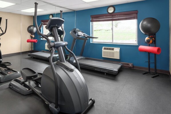 A gym with treadmills, an elliptical, and exercise balls. - Days Inn by Wyndham Rockford I-90 Casino District (Rockford)
