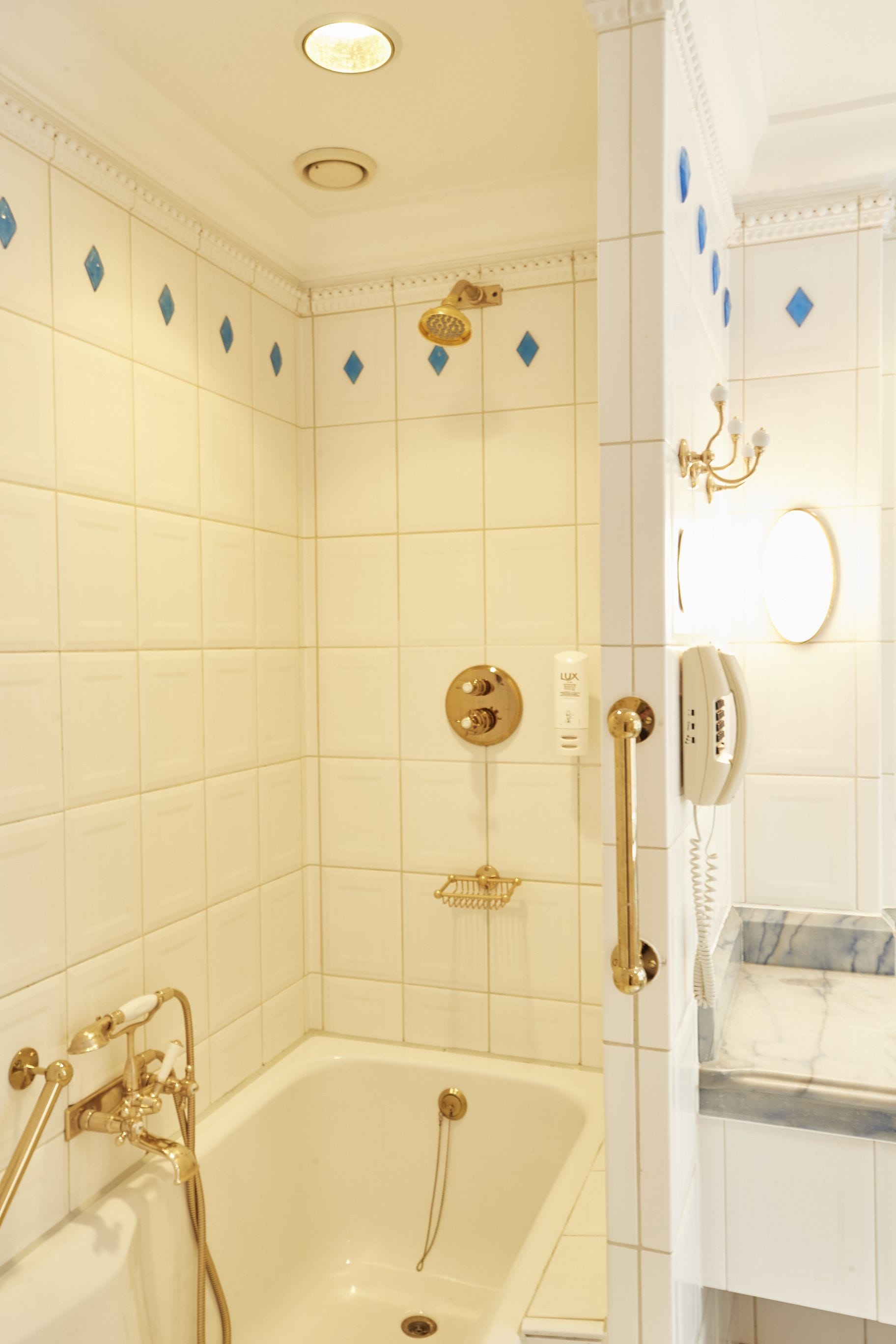 A bathroom with a bathtub, a shower, and a toilet.