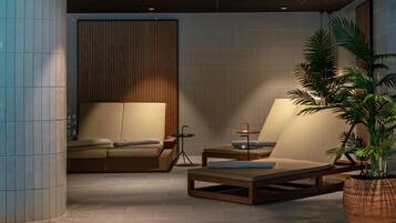 Relax in a serene space with a seating area, woven plant, and wooden panel wall.