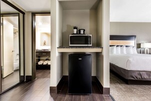 Premium bedding, desk, laptop workspace, blackout drapes