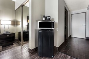 Premium bedding, desk, laptop workspace, blackout drapes