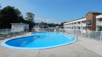 Seasonal outdoor pool, open 10:00 AM to 10:00 PM, pool loungers