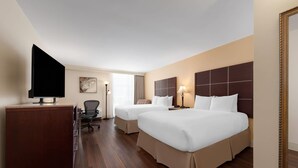 A hotel room with two beds, a desk, a chair, a television, and a painting on the wall. - Wyndham Riverfront Little Rock (North Little Rock)