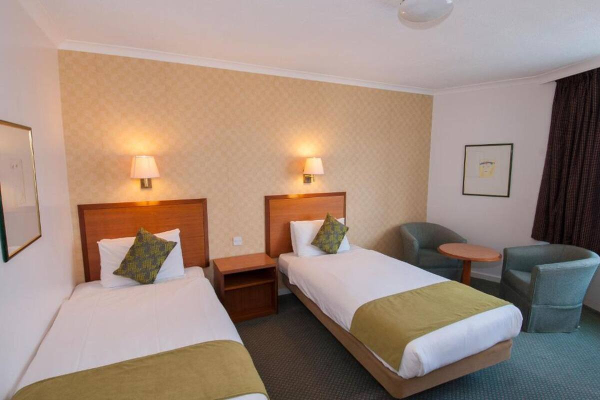 Twin Room | Iron/ironing board (on request), cribs (free), WiFi (free), bed sheets