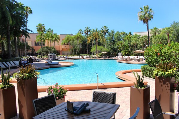 Outdoor pool, open 6:00 AM to midnight, pool umbrellas, pool loungers