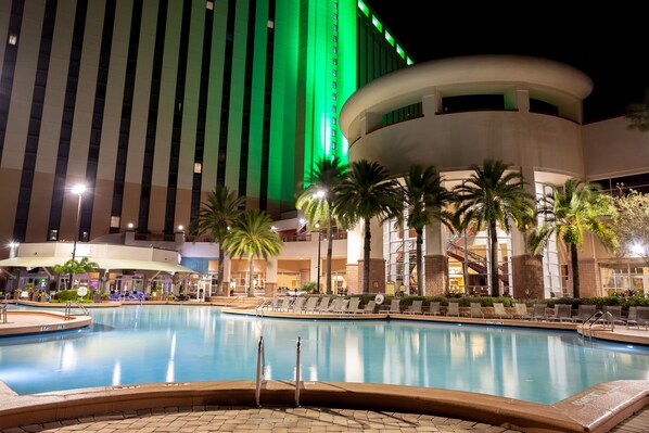 Outdoor pool, open 6:00 AM to midnight, pool umbrellas, pool loungers