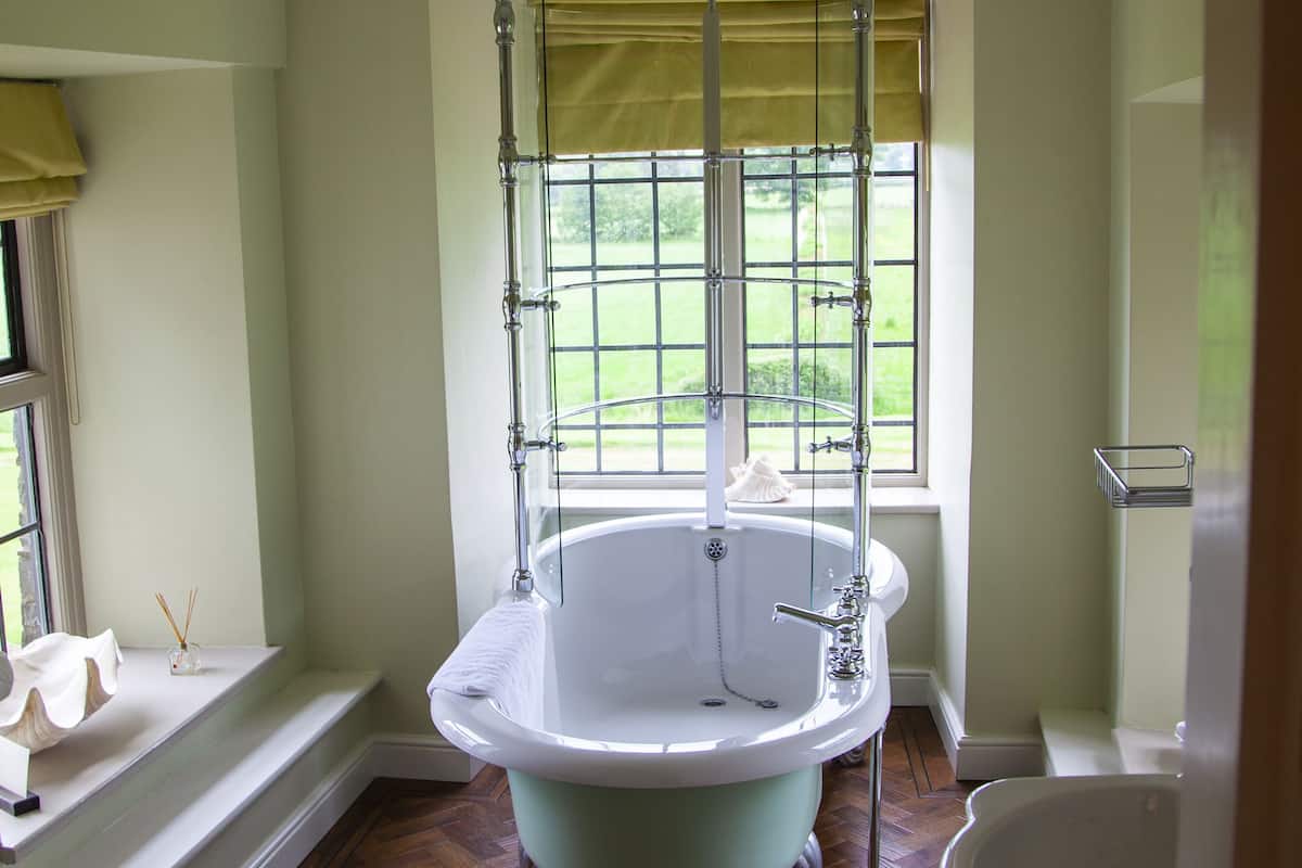 junior suite | bathroom | separate bathtub and shower, deep-soaking bathtub, rainfall showerhead