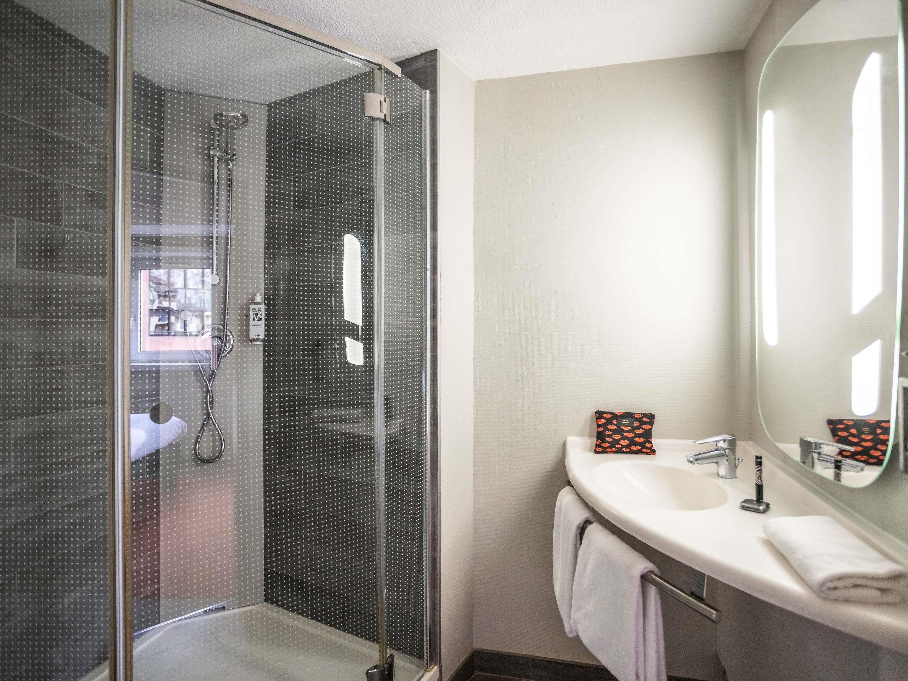 Shower, eco-friendly toiletries, hair dryer, towels