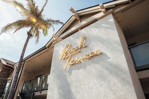 A building with a sign that reads "Beach Terrace."