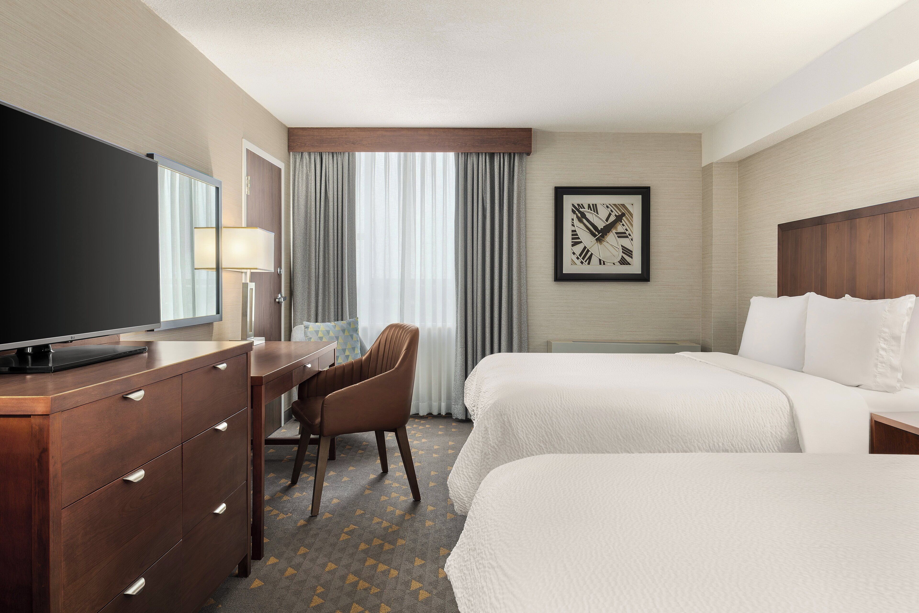 Pillowtop beds, desk, blackout drapes, iron/ironing board