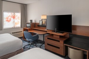 Premium bedding, desk, laptop workspace, blackout drapes