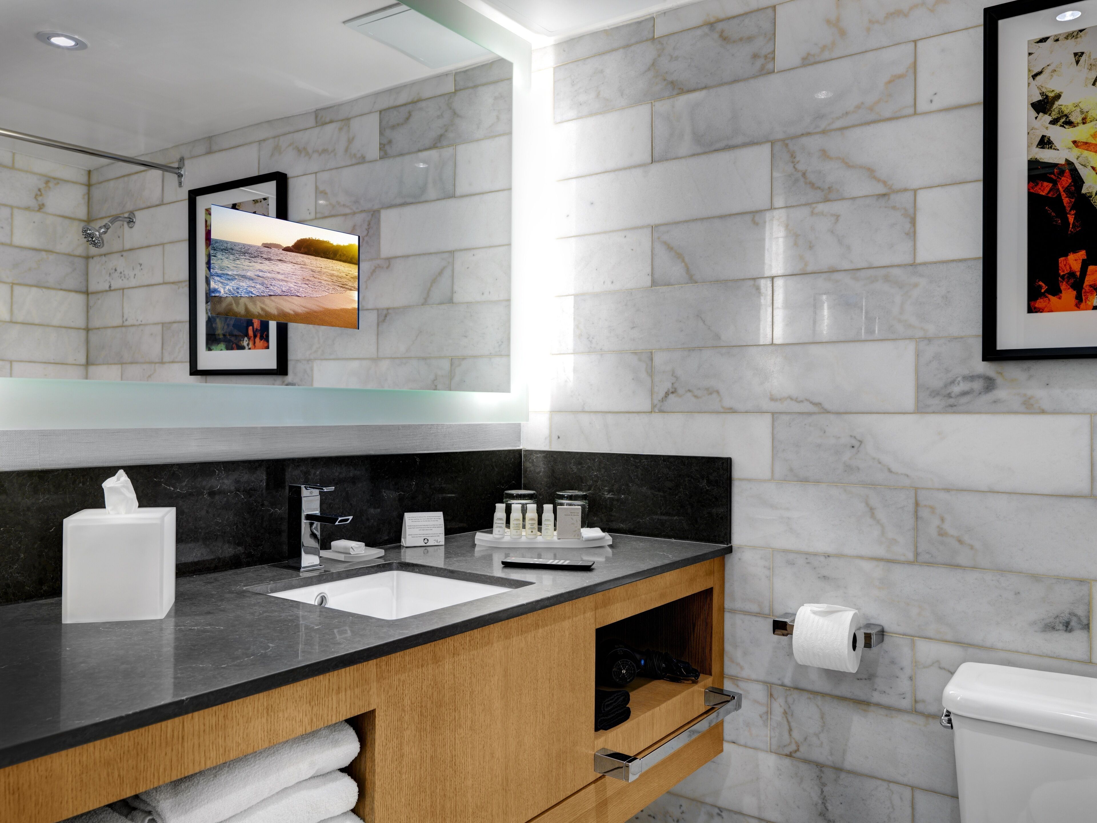 designer toiletries, hair dryer, towels