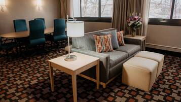 Desk, laptop workspace, blackout drapes, iron/ironing board