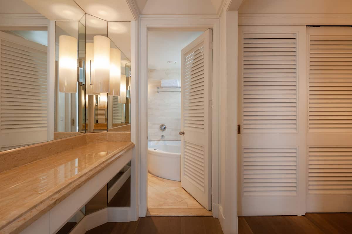 one bedroom sea view deluxe suite | bathroom | designer toiletries, hair dryer, bathrobes, slippers