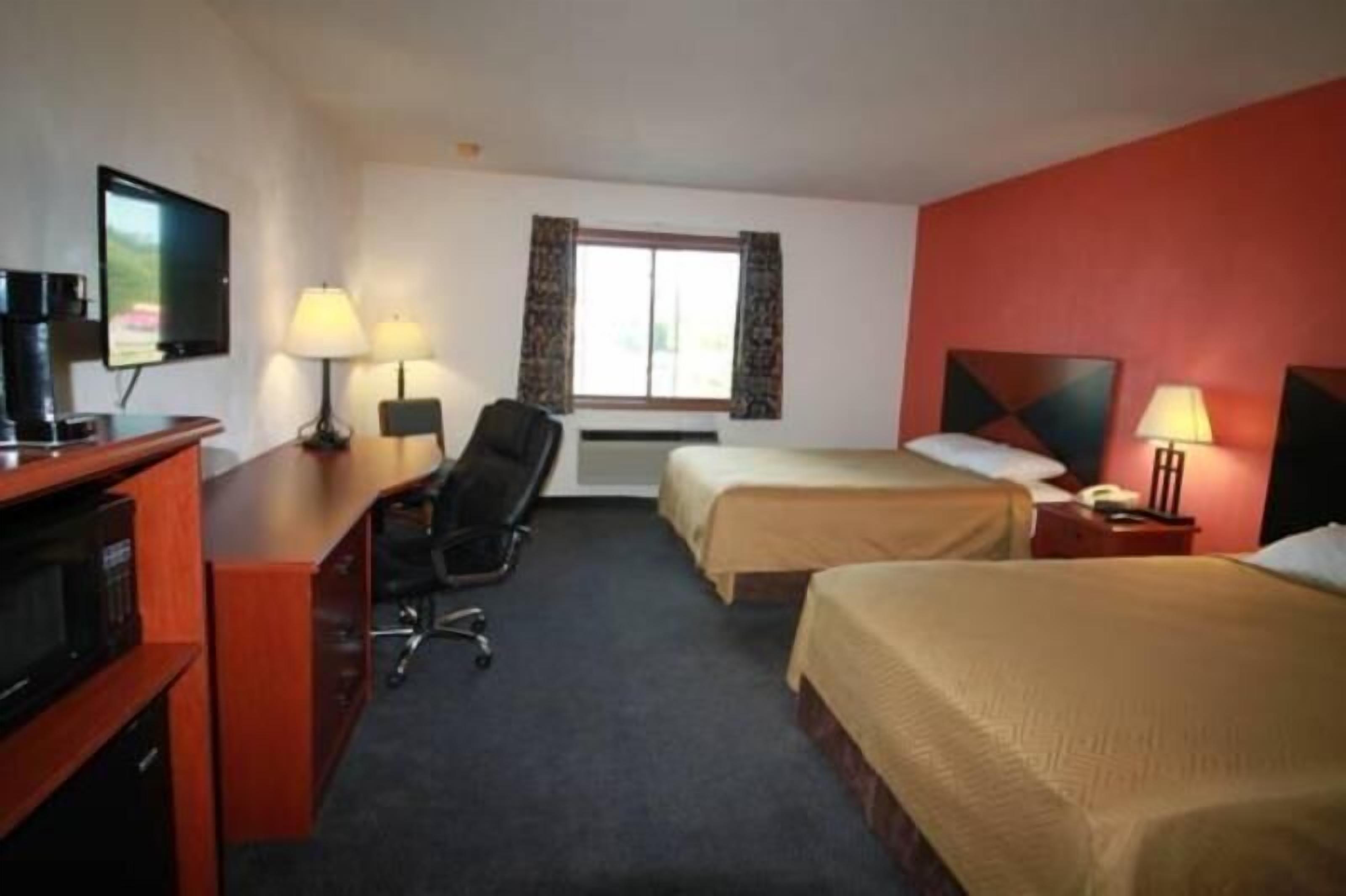 Desk, laptop workspace, iron/ironing board, bed sheets