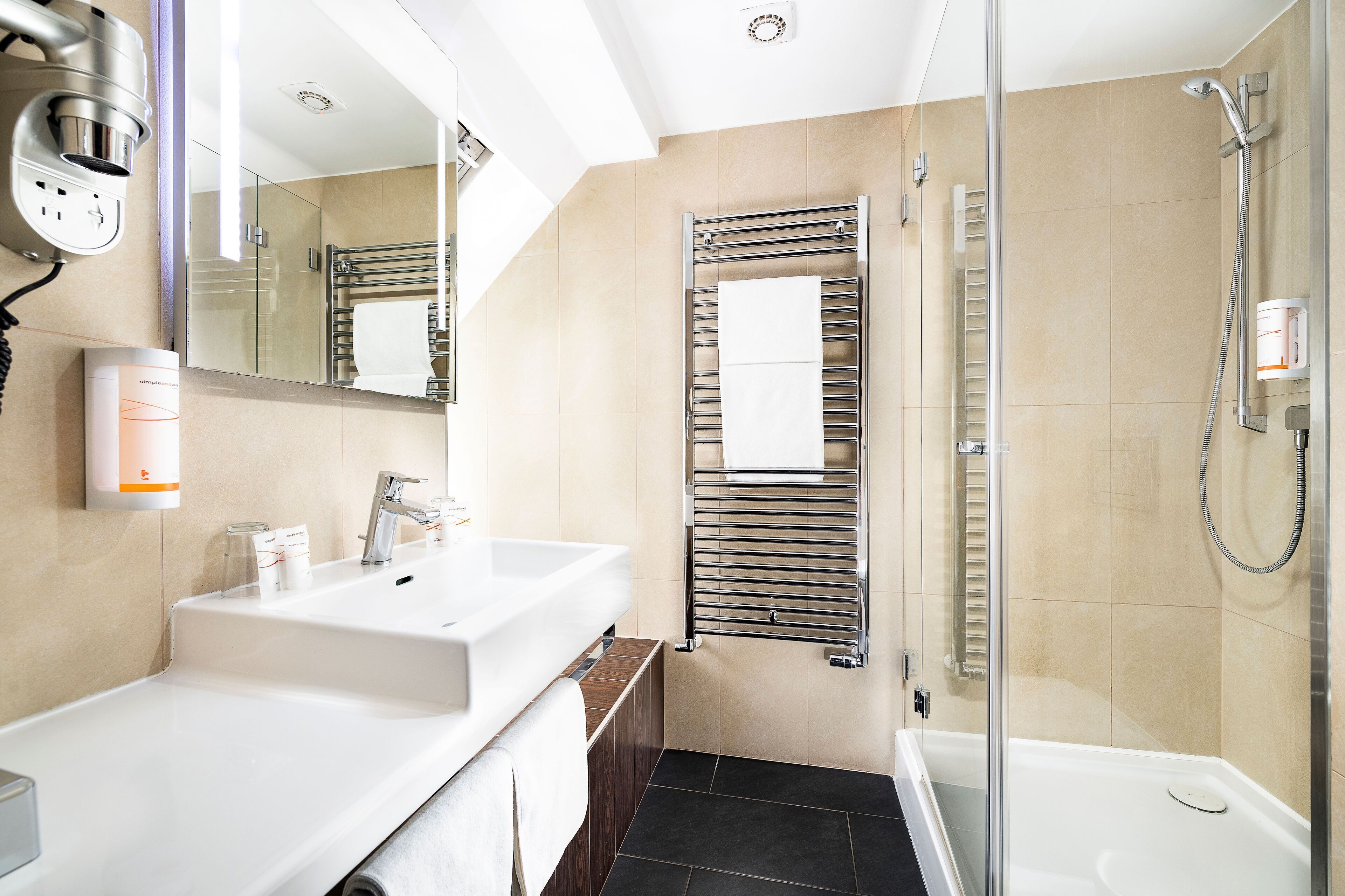 celebration room | bathroom | eco-friendly toiletries, hair dryer, towels, toilet paper