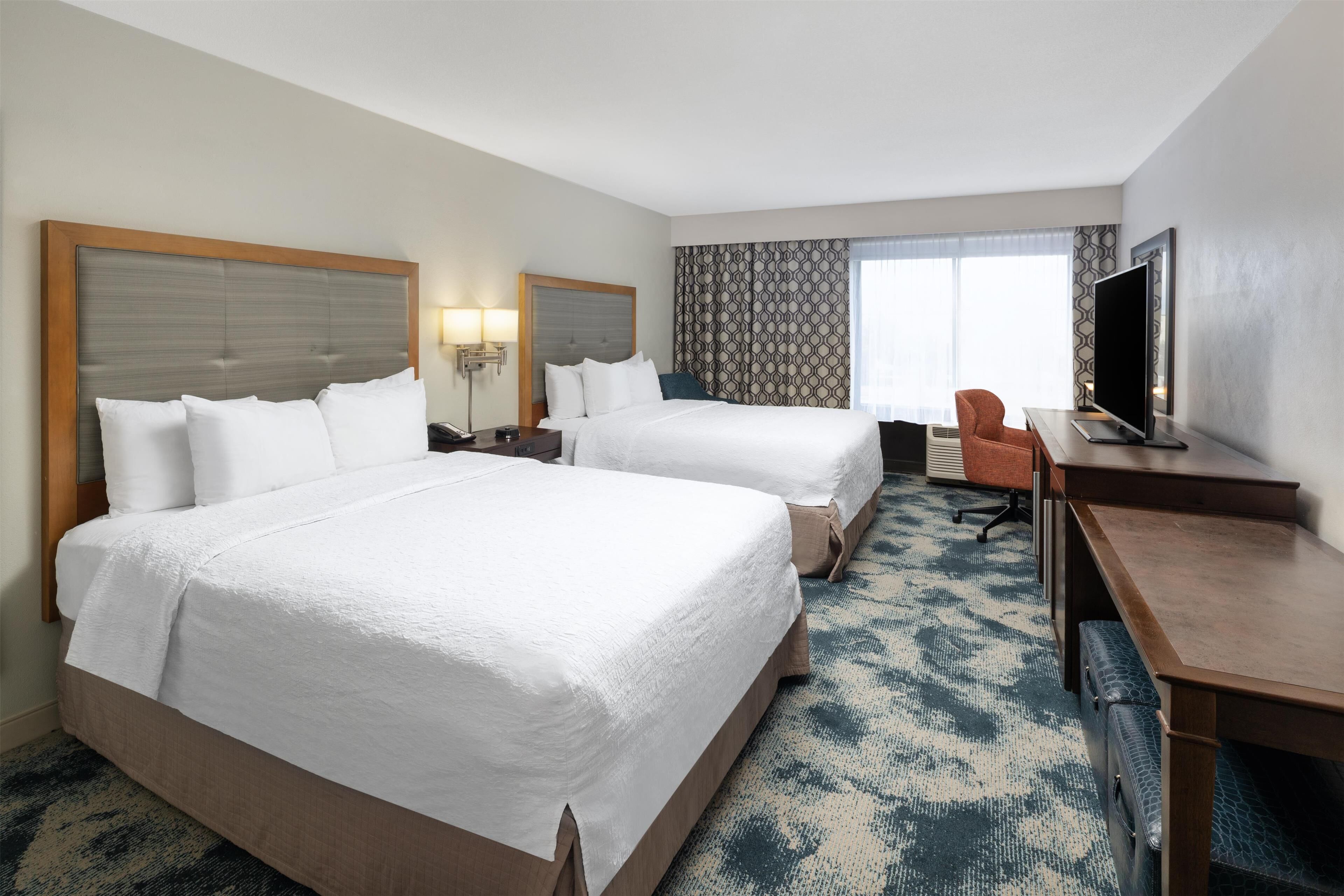 standard room with two double beds | in-room safe, desk, iron/ironing board, free cots/infant beds