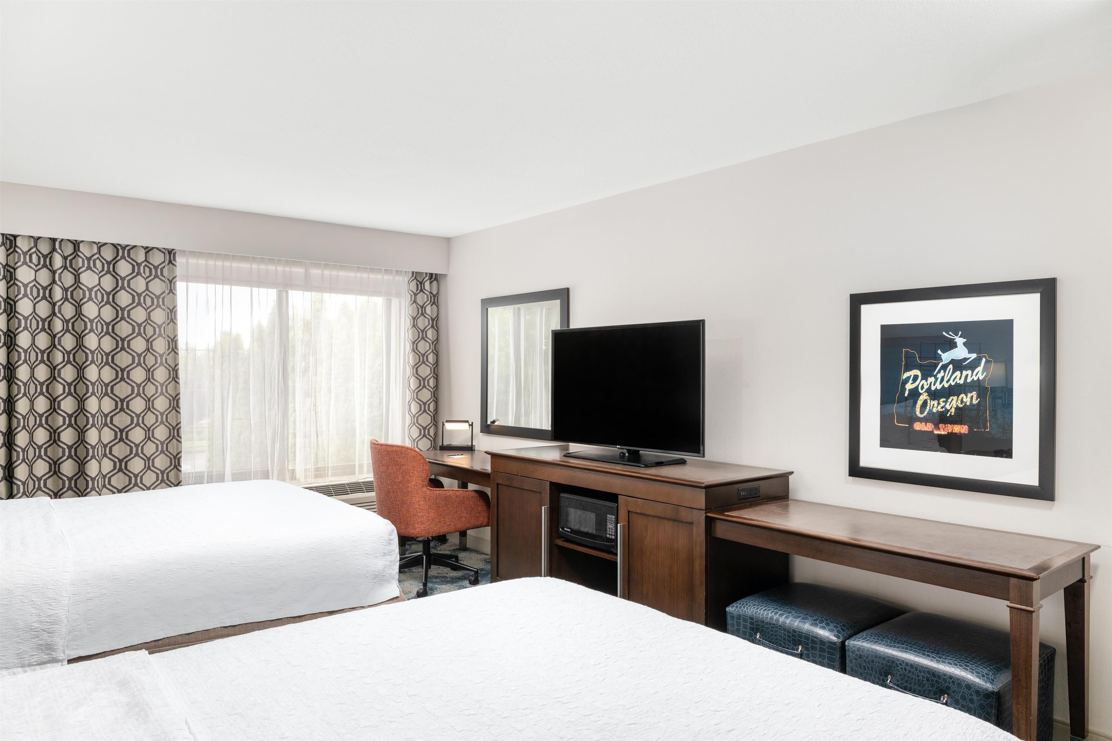 standard room with two double beds | in-room safe, desk, iron/ironing board, free cots/infant beds