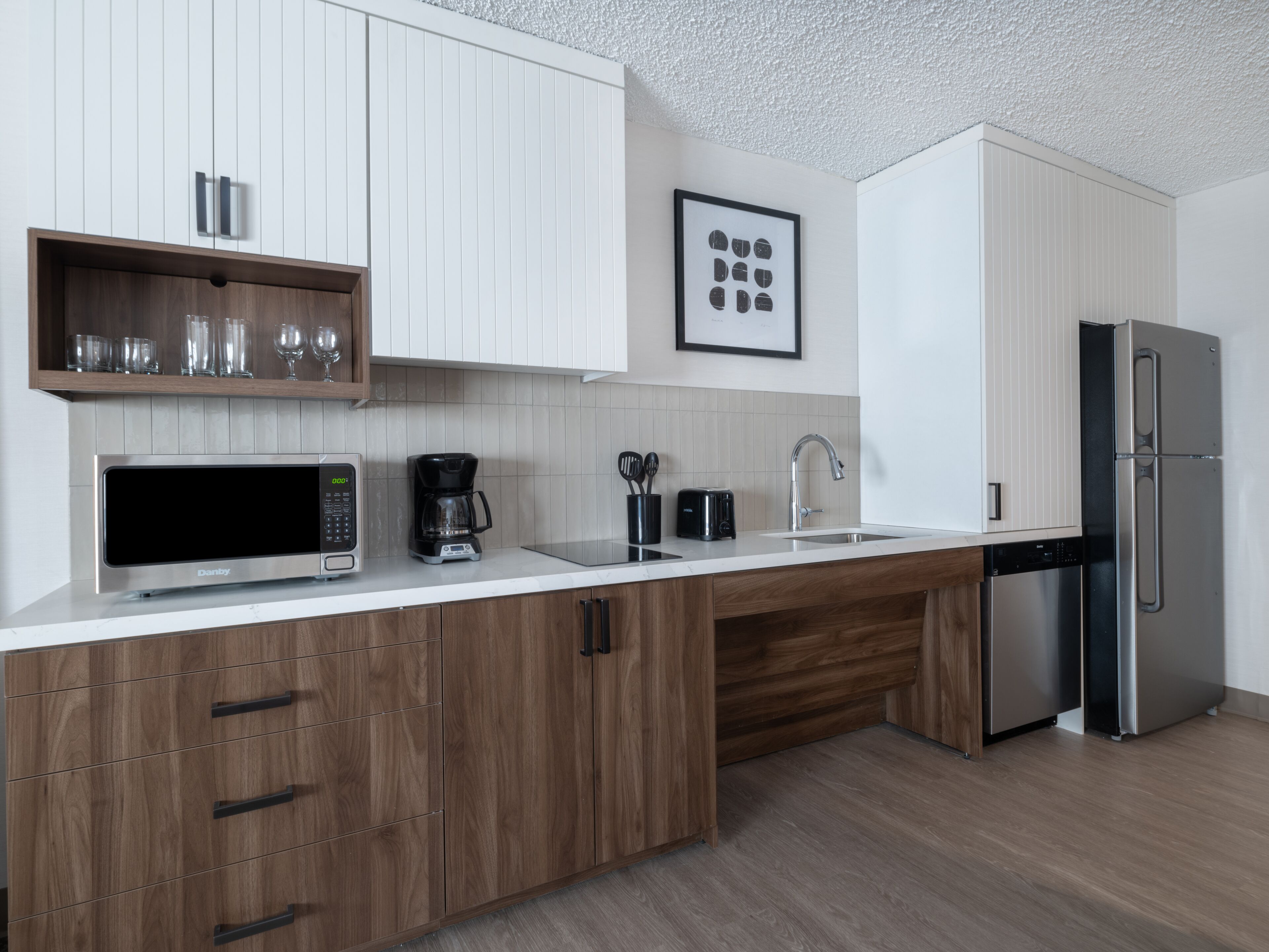 full-sized fridge, microwave, stovetop, dishwasher