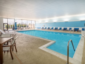 Indoor pool, open 8:00 AM to 10:00 PM, pool loungers