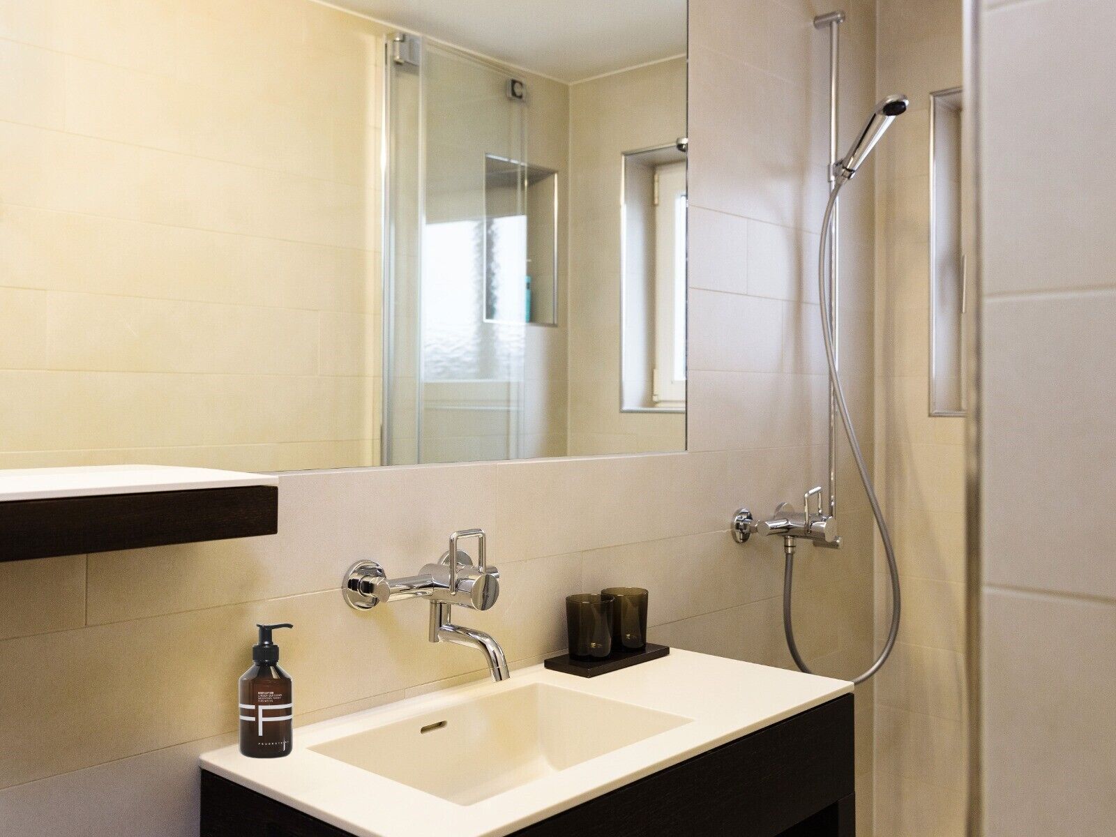 designer toiletries, hair dryer, slippers, towels