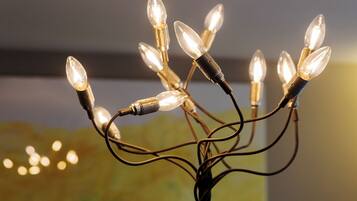 A string of clear glass bulbs with a warm glow, connected by a black wire.