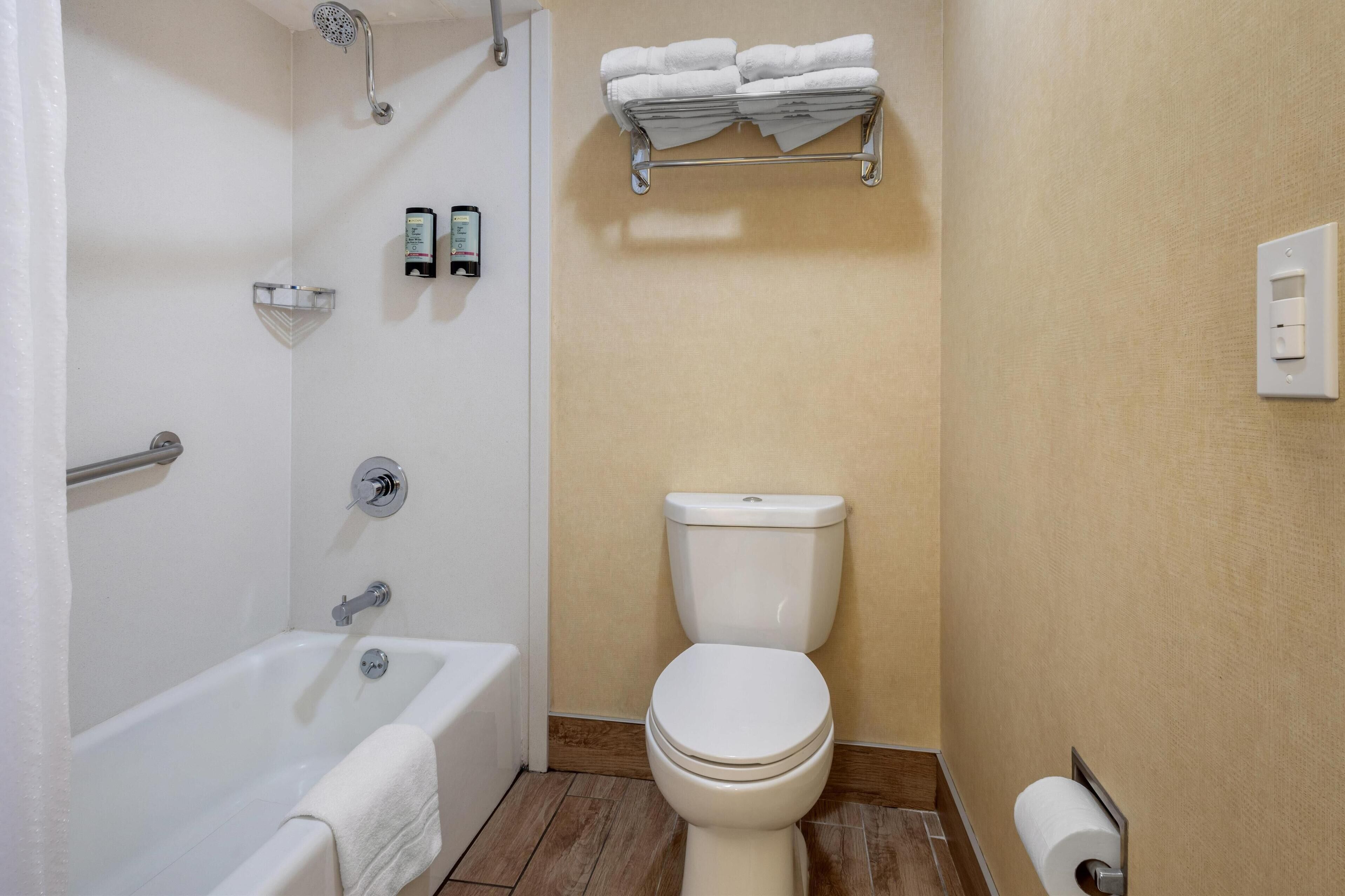 standard room, 2 queen beds, non smoking, refrigerator & microwave | bathroom | combined shower/bathtub, free toiletries, hair dryer, towels