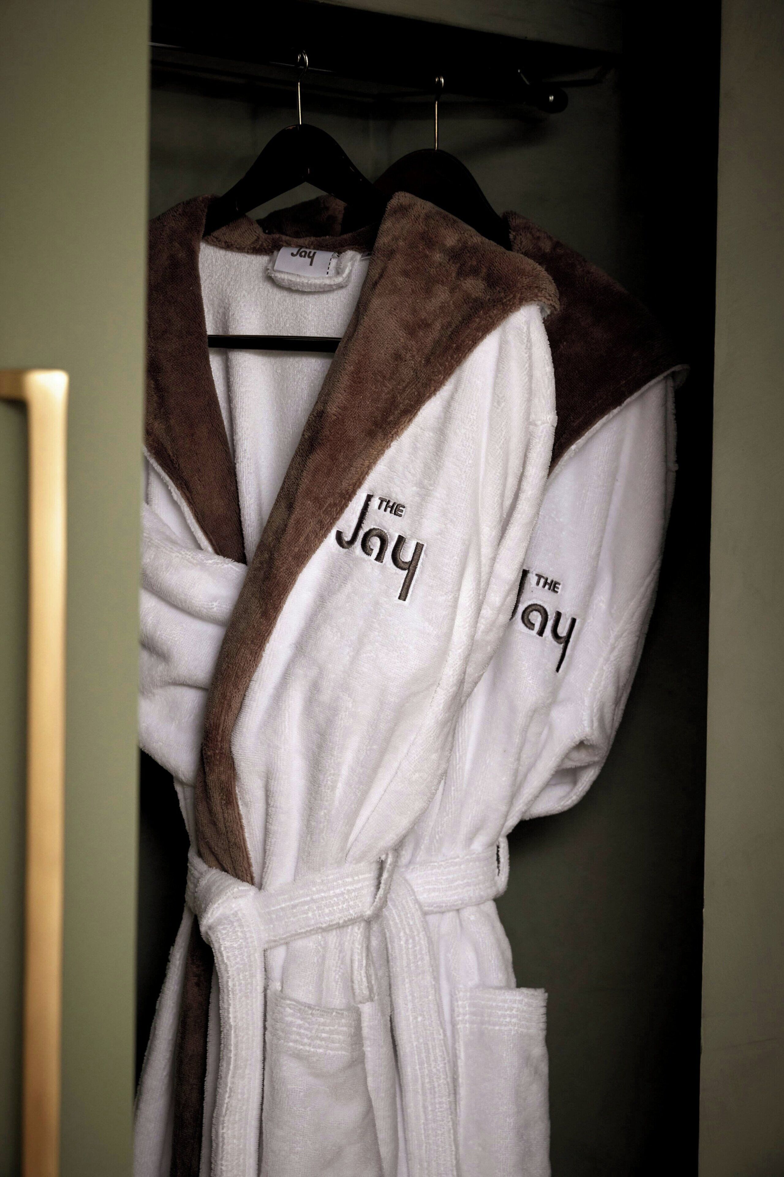 combined shower/bathtub, designer toiletries, hair dryer, bathrobes