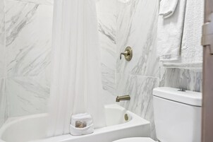 Combined shower/tub, towels, soap, shampoo