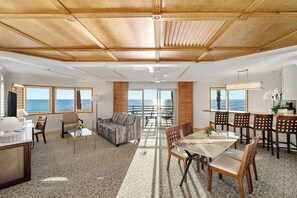 Grand Pacific Suite | Living area | 65-inch plasma TV with cable channels, TV, pay movies - Pacific Terrace Hotel (San Diego)