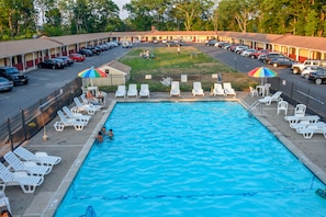 Seasonal outdoor pool, pool umbrellas, pool loungers