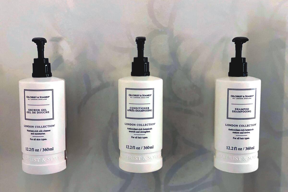 Three bottles of Gilchrist & Soames London Collection products: Shower Gel, Conditioner, and Shampoo.