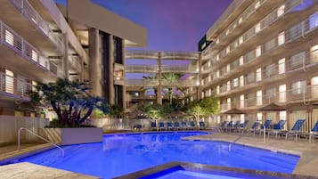 Outdoor pool, open 7:00 AM to 10:00 PM, sun loungers